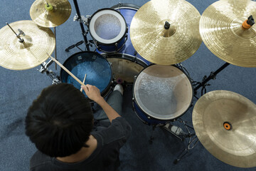Drum set with drumstic on stage.Musician playing drum during a live performance.Drummer rock jazz...