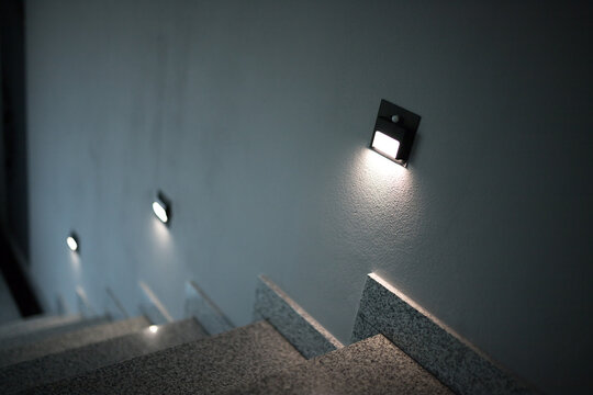 Illumination of steps with lamps with motion sensors.  Illumination of the corridor with small bulbs.
