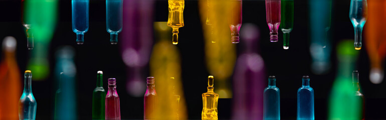 various miniature bottles of alcohol without labels with black bacground