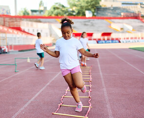 child sport athlete childhood girl competition fun young outdoor active exercise kid running fitness training athletic game healthy group play team school exercising