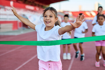 child sport athlete competition running race victory success win winner exercise sprinting runner achievement finish line finish celebration challenge happiness winning motivation excitement