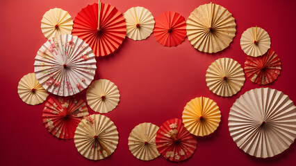 Obraz premium Top View of Oriental Paper Folding Fan decorative Pattern on Red Background with Free space Composition. Lunar New Year Celebration. Happy New Year Traditional Holiday