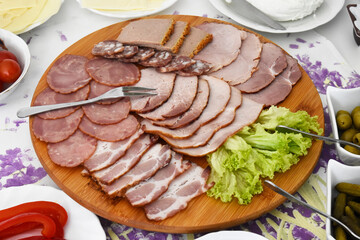 A board with a set of tasty cold cuts