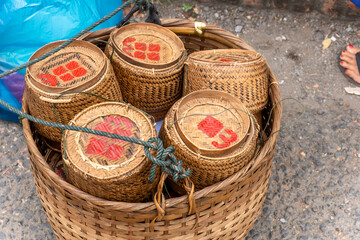 several kratip, ritual rice baskets made with strands of rattan and bamboo, it is also at the heart of certain religious rituals in Luang Prabang, Laos