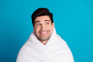 Photo portrait of nice young male look empty space wrapped duvet wear nightwear sleepover good...