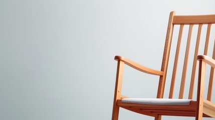 Minimalist Wooden Chair with White Cushion on Light Grey Background, Emphasizing Simplicity and Modern Design, Ideal for Interior Decor and Furniture Themes