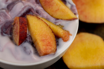 natural yogurt in a white bowl with fruits
