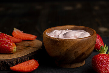 yogurt made from milk with added flavor and pieces of ripe strawberries