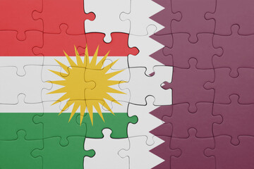 puzzle with the colourful national flag of kurdistan and flag of qatar .
