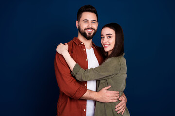 Photo of lovely charming couple wife husband wear stylish clothes isolated on dark blue color background