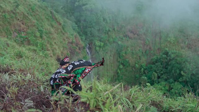 An epic performance of a traditional dance with mystical nuances performed by a dancer from one of the tribes in Indonesia. The traditional Guel dance which comes from one of the tribes in Indonesia