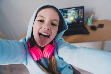 Photo of crazy cool funly positive cute girl blogger gamer showing room recording video live stream indoors house © deagreez