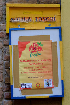 Antifascist dinner announcement on a public board in parma, italy