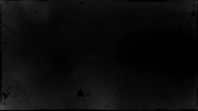 Film grain and scratches on a black and white filmstrip. Overlay effect.