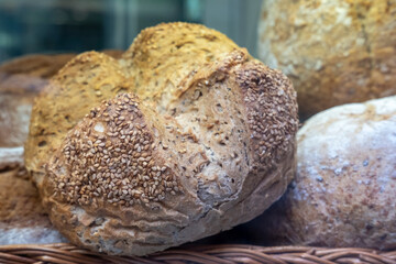 Fresh homemade sourdough bread on a rustic background with copy space.