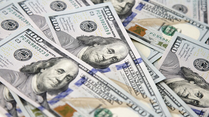 American cash dollars close up. A large amount of cash American dollars in cash paper bills. Finance concept