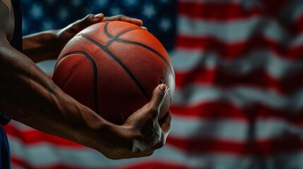 Close-up of a person holding a basketball with an American flag in the background, symbolizing sports and patriotism.