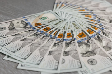 Close-up of cash American dollar bills. Concept nailed, finance and income.