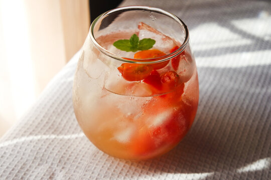 Tomato ade is a common drink in cafe consist of tomato with soda and garnished with mint.