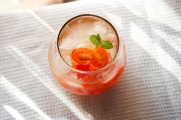 Tomato ade is a common drink in cafe consist of tomato with soda and garnished with mint.