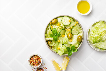 salad with olives, olive oil, cucumbers and corn