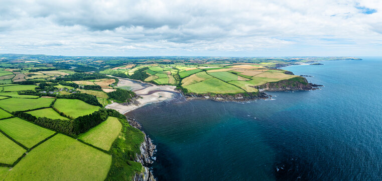 Panorama of Cliffs over Mothecombe Beach and Red Cove from a drone, River Emme, Mothecombe, Plymouth, South Devon, England, Europe