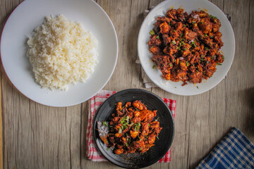 Chicken curry cooked in Indian style. The chicken is cooked and fried till dried.
