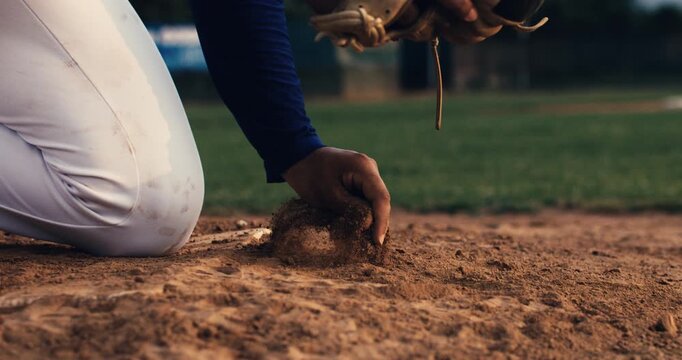 Super slow motion close up of baseball player taking from ground  baseball ball during competition game match on baseball stadium at 1000 fps.