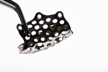 dental mesh made of titanium for bone building on a white background