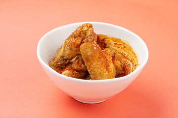 Portion of fried japanese shichimi togarashi chicken wings