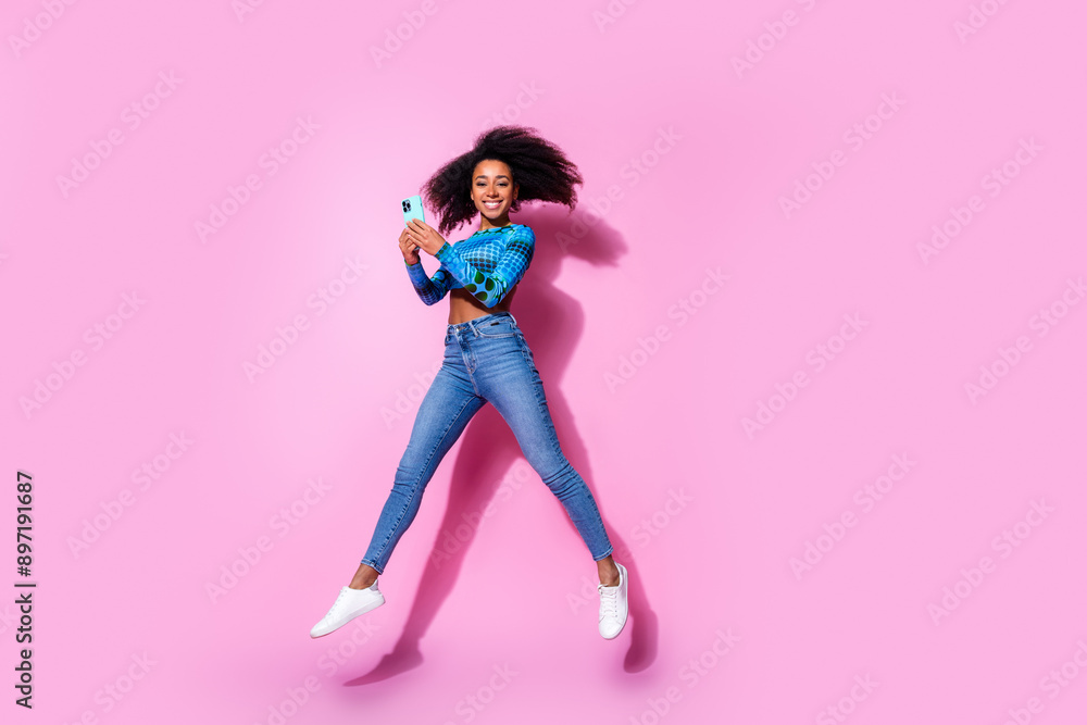 Poster Full size photo of lovely young lady hold device dressed stylish blue garment isolated on pink color background