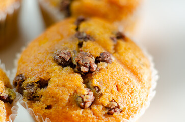 A close up of a muffin with chocolate chips on top