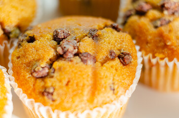 A close up of a muffin with chocolate chips on top