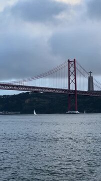 View of 25th of April Bridge in Lisbon, Portugal. Tagus river.