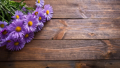 Bouquet of Purple lilac daisies on corner of vintage wooden table