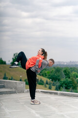 in the park a young couple in love doing sports couples warming up healthy lifestyle synchronized...