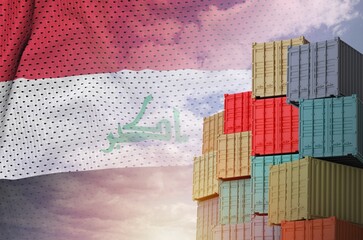 Iraq flag and big stack of shipping cargo containers in docks with sky background close up