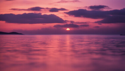 Obraz premium A breathtaking sunset over the sea, with the sky painted in hues of orange, pink, and purple 