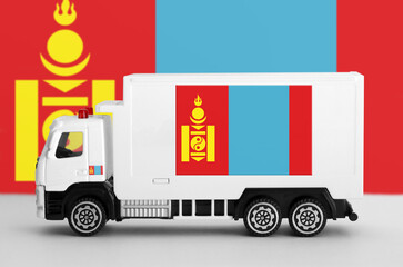 Mongolia flag depicted on side wall of white delivery van close up. Shipping and local delivery...