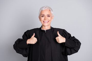 Photo of woman judge hold show thumb up gesture isolated grey color background