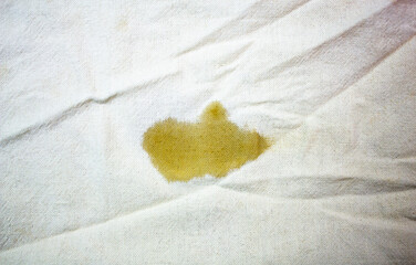 Stain's on the white cotton fabric. Stain from food, drink spilled on the fabric, clothes,...