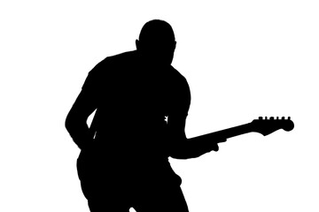 Isolated silhouette of a man playing guitar.