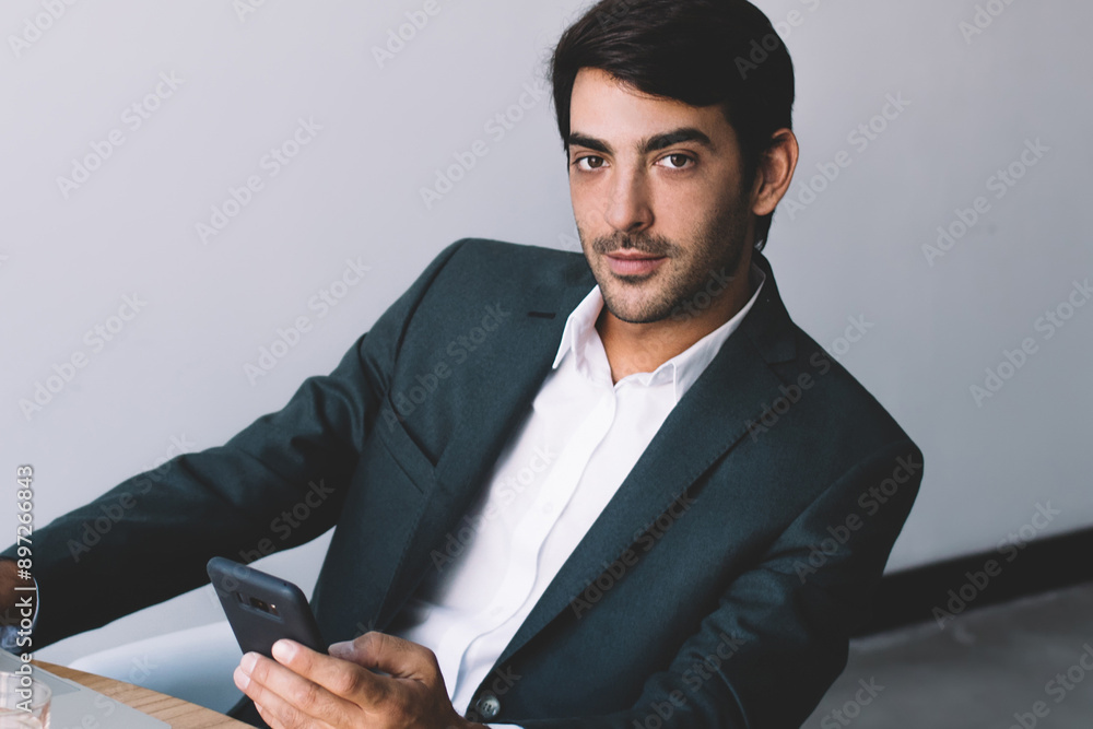 Aufkleber portrait of concentrated indian computer expert looking at camera and waiting colleague for meeting 
