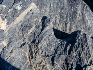 macro surface shot of a rock that looks like a large mountain
