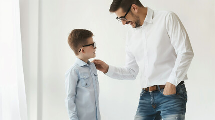 Fototapeta premium A happy father and son getting dressed for work and school, their looks reflect love and friendship.