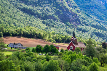 Olden Church is a parish church in Olden, Norway. The red, wooden church was built in a long church...