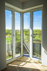 Corner window to the floor in the interior of the living room.