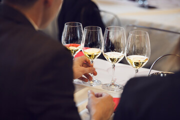 Sommelier Sampling White Wines at Tasting Event, Back Close up Photo.