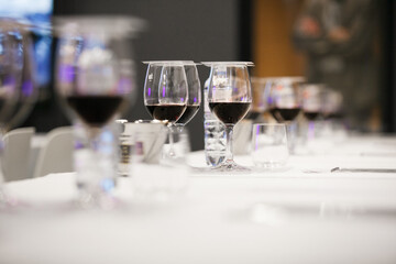 Full Wine Glasses Covered with Degustation Cards on Table, Professional Wine Tasting Event