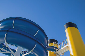 Modern aqua park with different speed waterslides on cruiseship or cruise ship liner for family fun